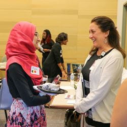 Medical student speaking with a faculty member