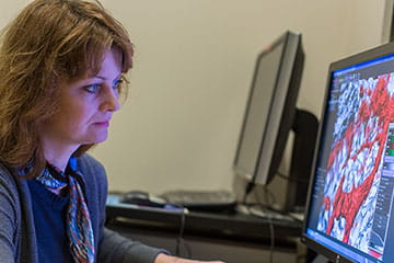 Woman looking at image on monitor
