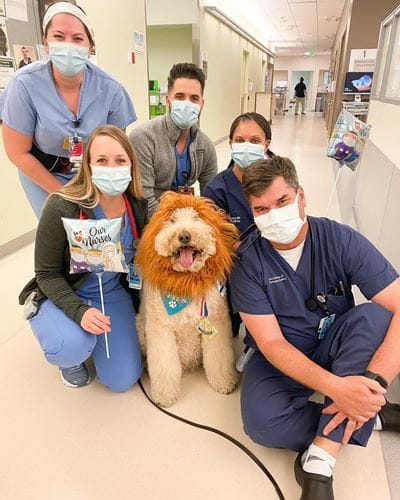 butch humbert posing with residents in the hospital