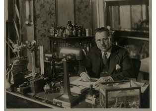 Clarence Lucas, Sr., MD at his office desk