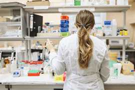 A female student works in a research lab.