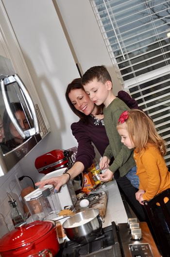 Crissy Quenichet cooking with her kids