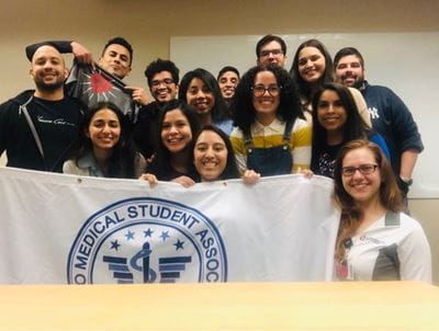 Latino Medical Student Association group with flag