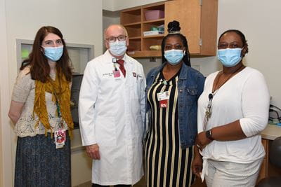 Julia LaMotte with Dean Hess and colleagues in the sickle cell clinic at Riley