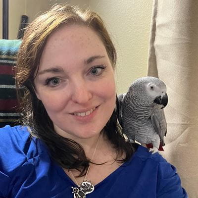 Elle Geddes and African gray parrot MacGyver
