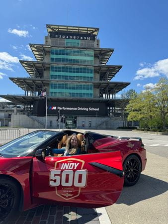 Elizabeth Baker at the Indianapolis Motor Speedway in a red pacecar