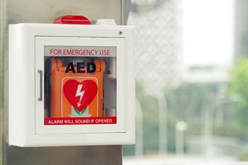 An AED stationed at an outdoor basketball court