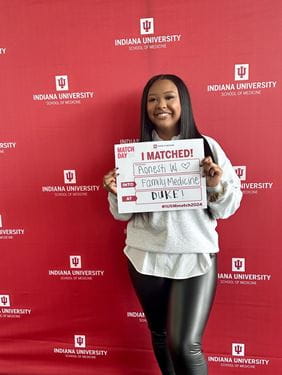 Aonesti Williams holds her Match Day sign