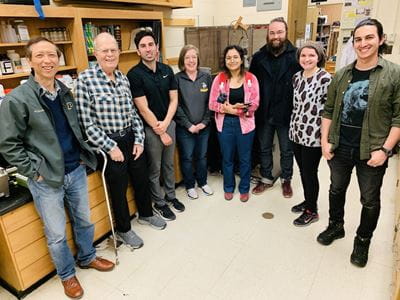 Researchers Riyi Shi, Arthur Rosen, Ed Rogers, and other lab members at the Shi lab at Purdue.