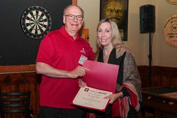 Dean Jay Hess with Dr. Patty Tharp, holding her award certificate
