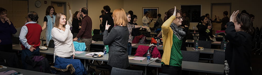 Faculty and staff participate in The Mirror exercise during a past improv exercise at IU School of Medicine.