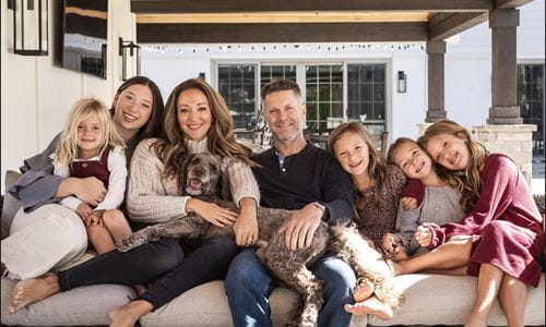 Lindsay and Chris Weaver at home with their five daughters