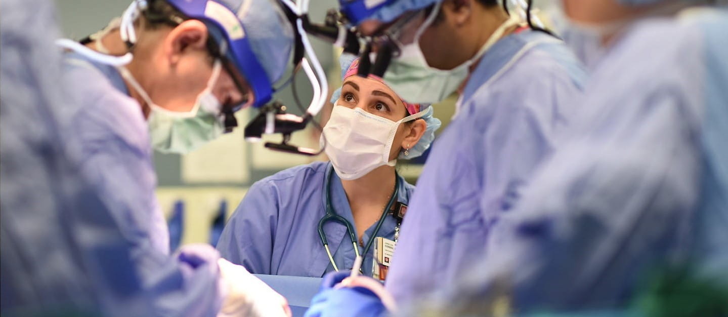 an anesthesiologist works alongside surgeons in the operating room