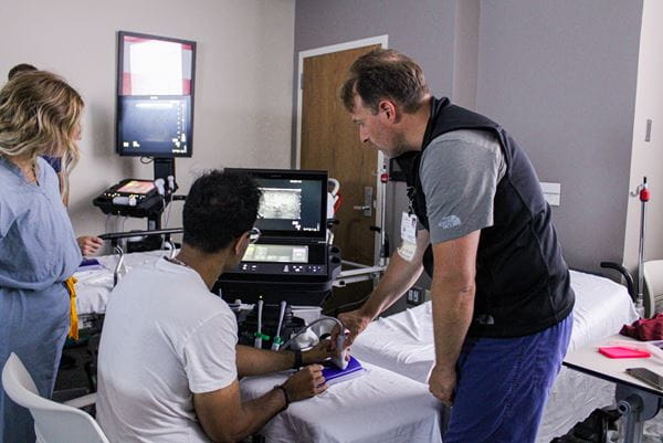Dr. Rob Ferre teaches residents how to perform ultrasound.