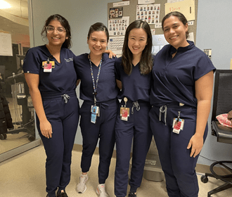 4 residents posing on wards.
