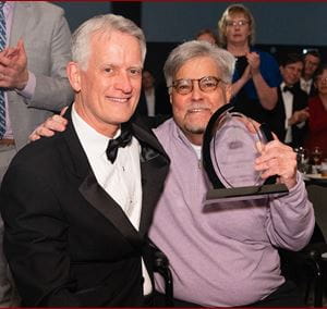 Photo of Stuart Sherman holding his ASGE Rudolf A. Schindler Award in 2023.