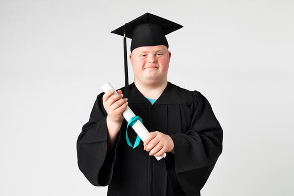 Adolescent in graduation cap and gown.