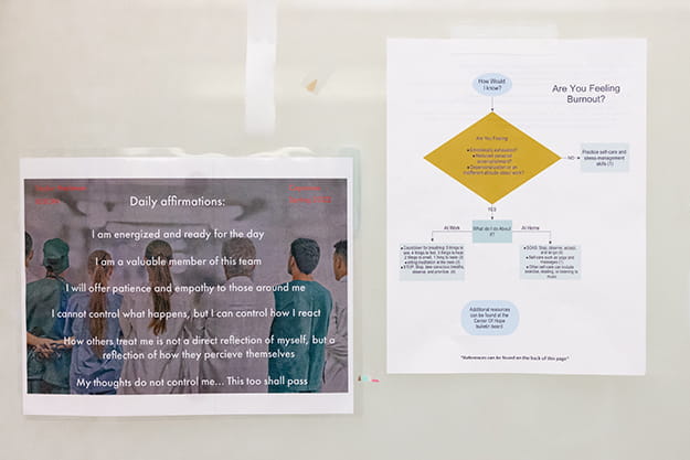 A flyer taped to the wall lists daily affirmations over a background photo of physicians standing together. 