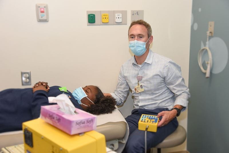 a physician and a patient in an appointment for sickle cell disease