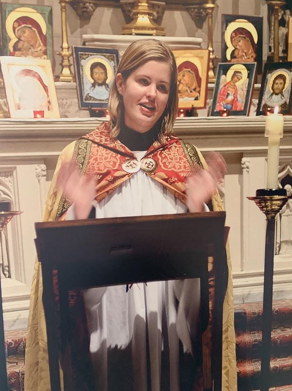 emily wachner leads a service in the garb of an episcopal priest