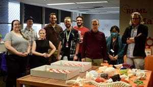 VR team celebrates in the Makerspace with cupcakes